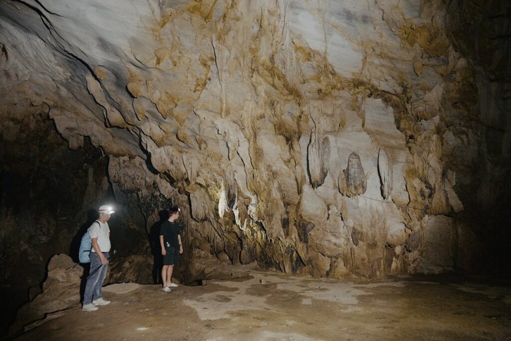 Two men exploring the caves